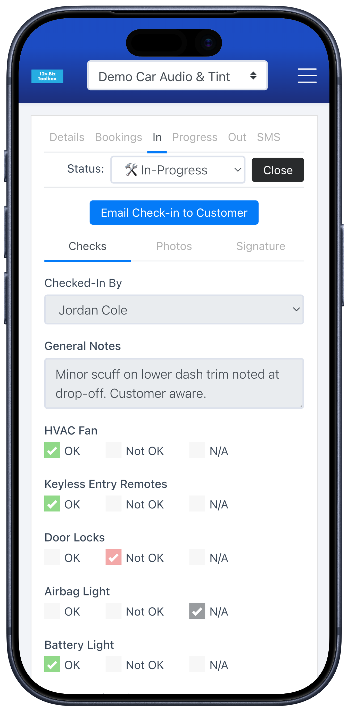 Digital vehicle check-in on a phone: a pass/fail/N-A inspection checklist with saved vehicle photos and a captured customer signature.