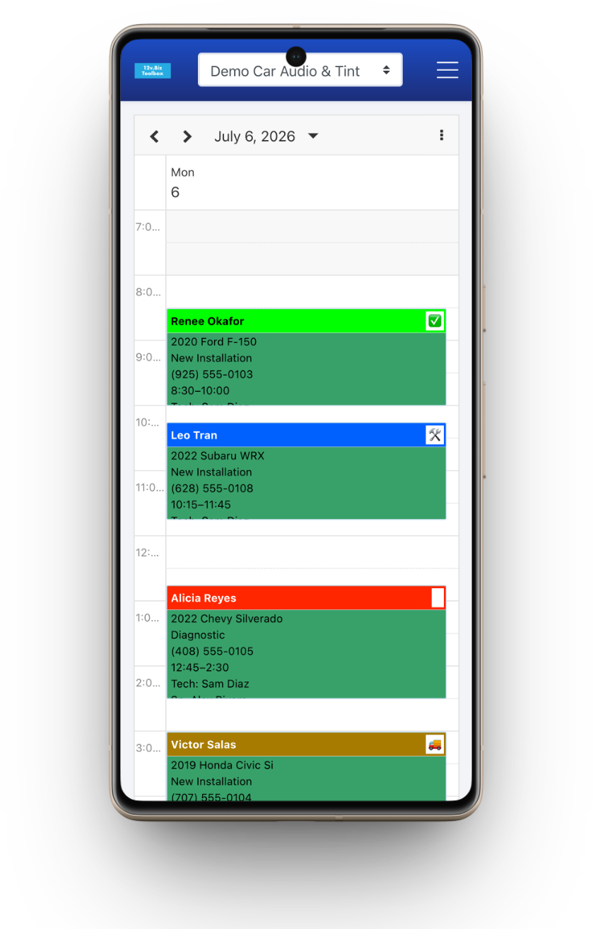 12v.Biz Toolbox Techs-Day scheduler: each technician's column with color-coded jobs — vehicle, time, and tech — for the day.