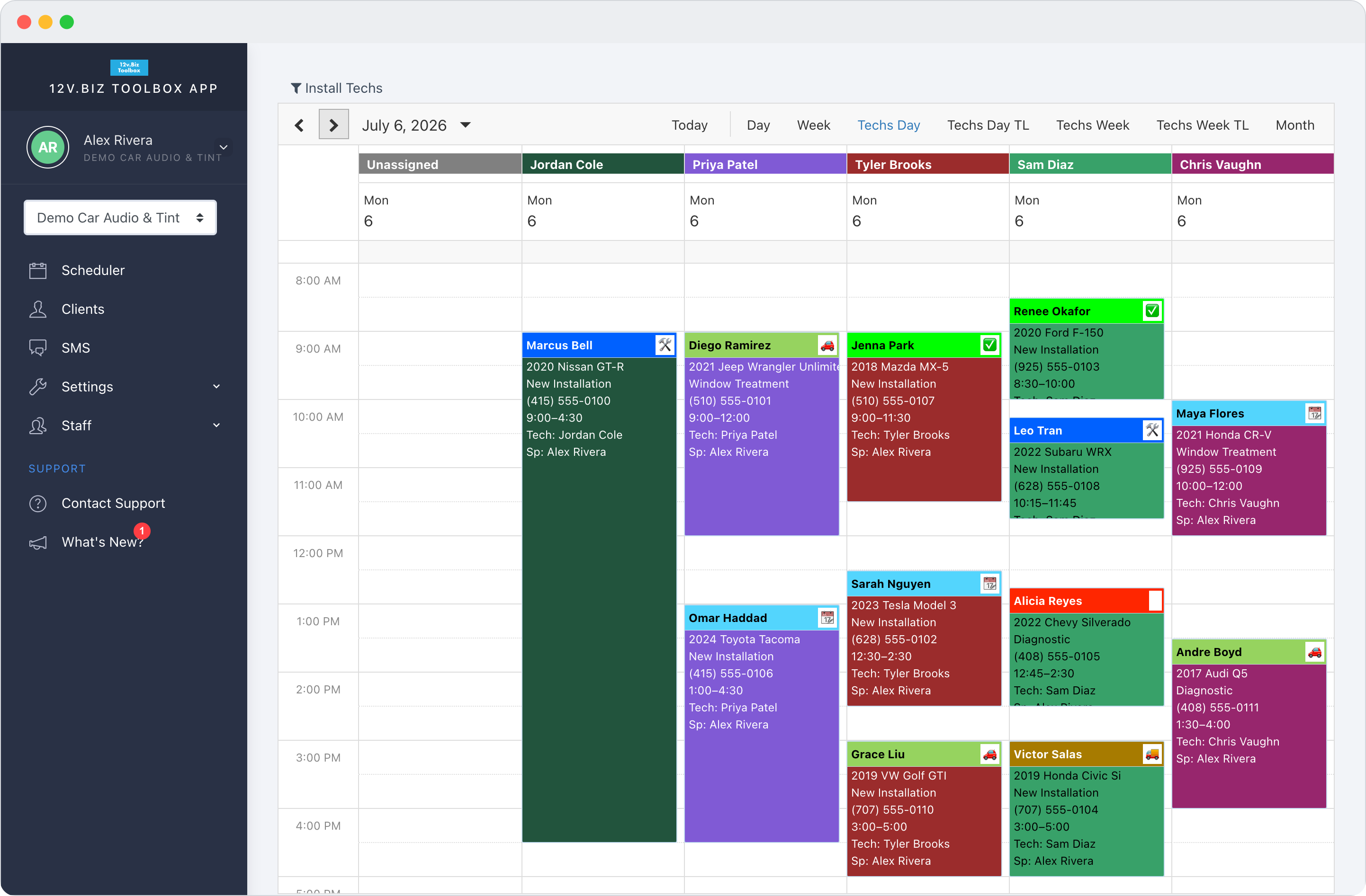 12v.Biz Toolbox Techs-Day scheduler: each technician's column with color-coded jobs — vehicle, time, and tech — for the day.